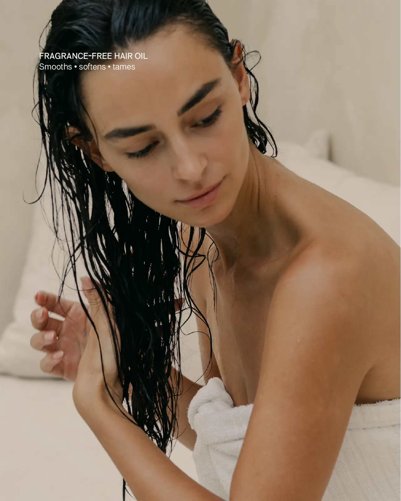Woman with wet hair wrapped in a towel, with text about fragrance-free hair oil.